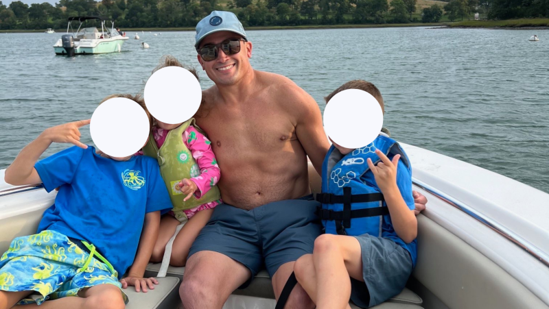 Jimmy with his family in the original client spotlight image, with the children’s privacy covers preserved